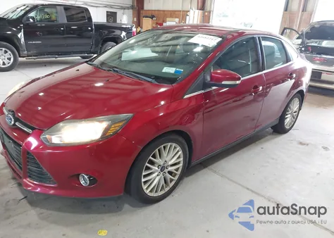 2014 Ford Focus Titanium z USA, uszkodzony, nr VIN 1FADP3J22EL308703